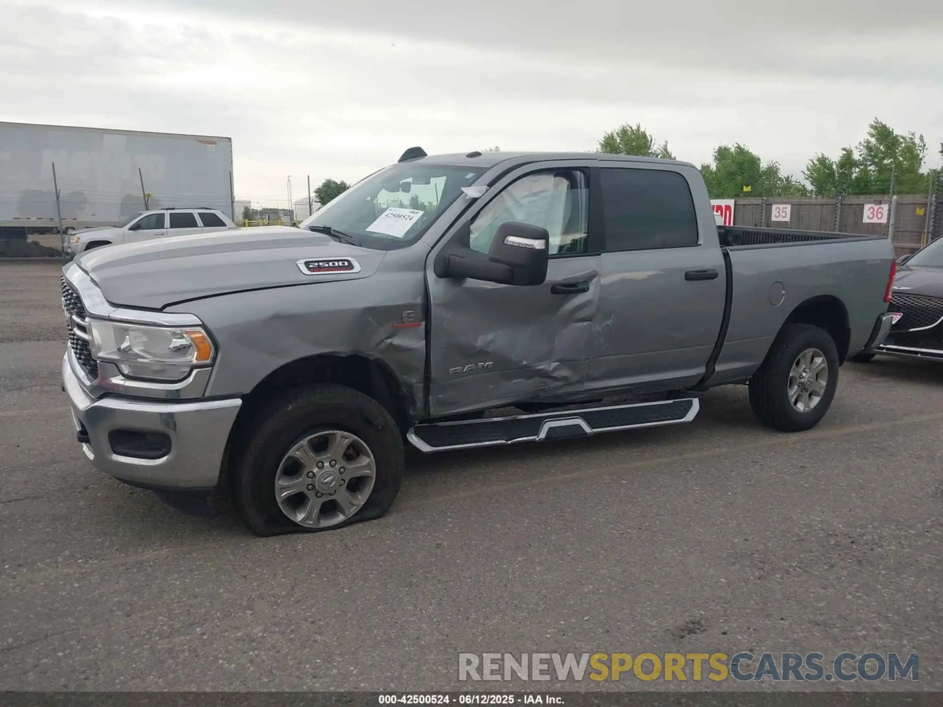 14 Photograph of a damaged car 3C6UR5DL5RG154048 RAM 2500 2024