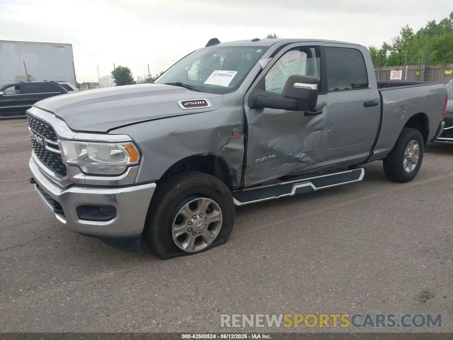 2 Photograph of a damaged car 3C6UR5DL5RG154048 RAM 2500 2024