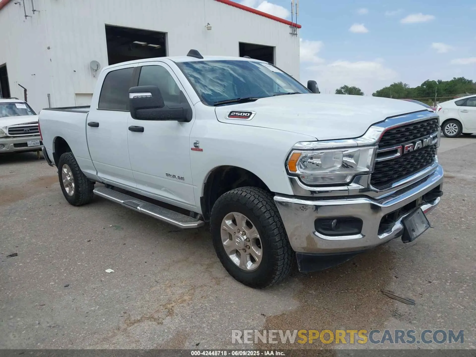 1 Photograph of a damaged car 3C6UR5DL9RG154280 RAM 2500 2024