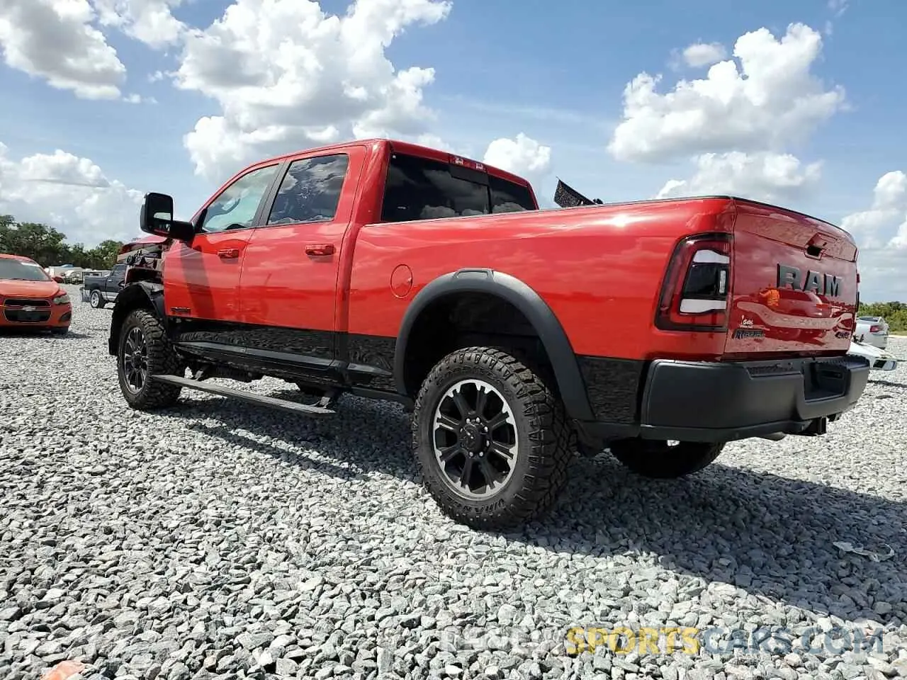 2 Photograph of a damaged car 3C6UR5EL0RG207351 RAM 2500 2024