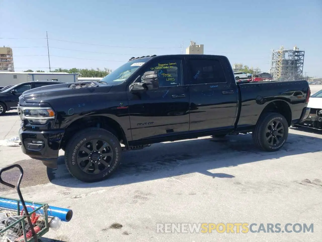 1 Photograph of a damaged car 3C6UR5FLXRG364108 RAM 2500 2024