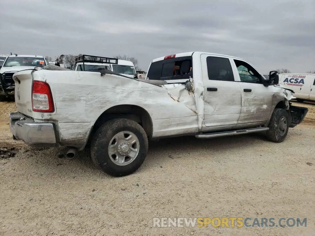 3 Photograph of a damaged car 3C6UR5HL6RG270451 RAM 2500 2024