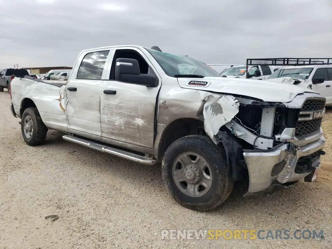 4 Photograph of a damaged car 3C6UR5HL6RG270451 RAM 2500 2024