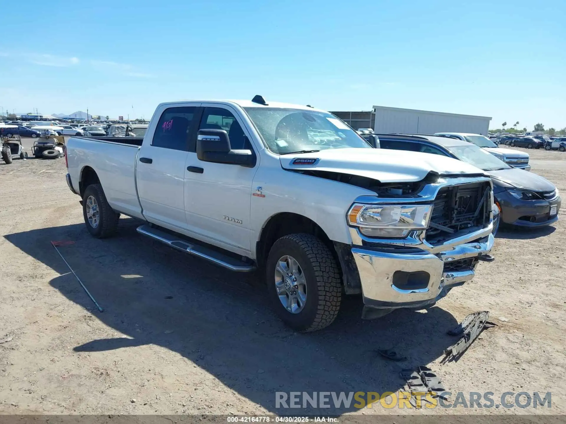 1 Photograph of a damaged car 3C6UR5JL2RG337668 RAM 2500 2024