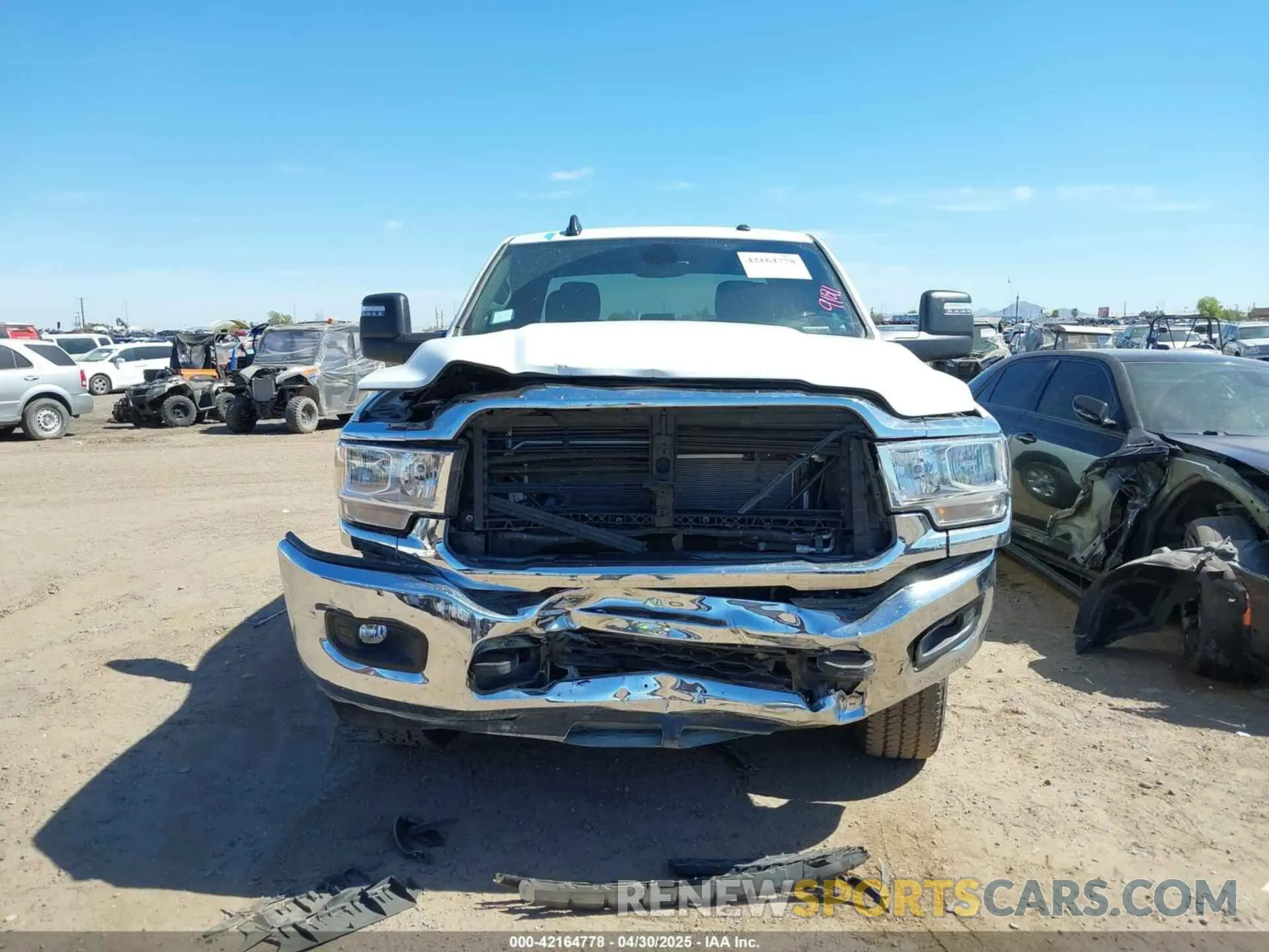 12 Photograph of a damaged car 3C6UR5JL2RG337668 RAM 2500 2024
