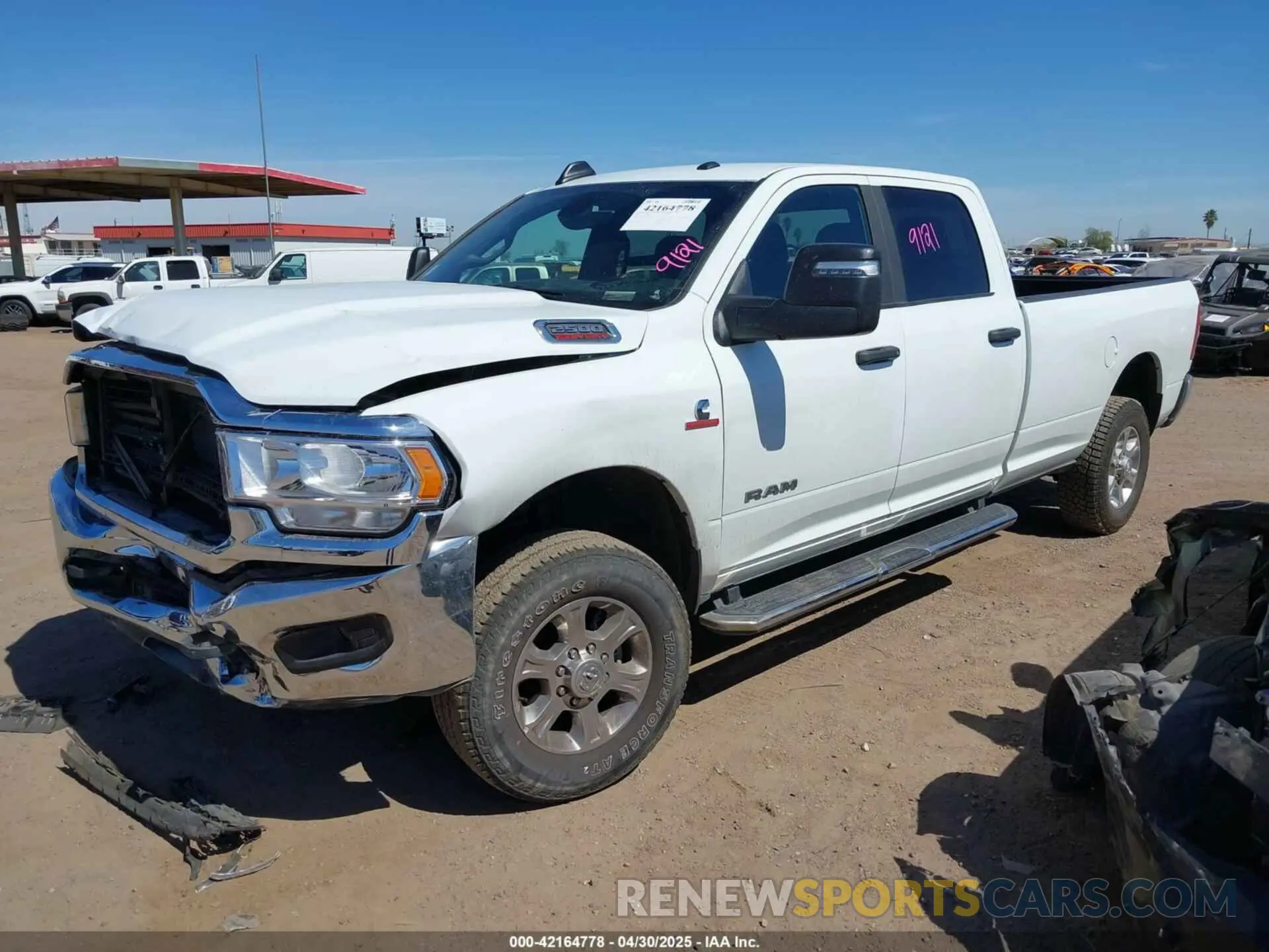2 Photograph of a damaged car 3C6UR5JL2RG337668 RAM 2500 2024