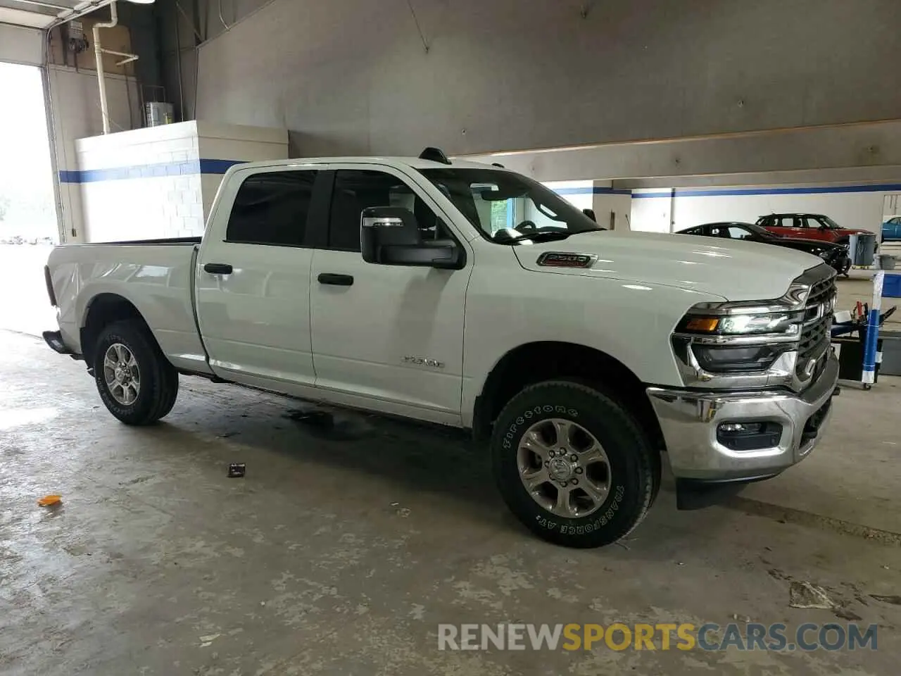 4 Photograph of a damaged car 3C6UR5DJ7SG519303 RAM 2500 2025