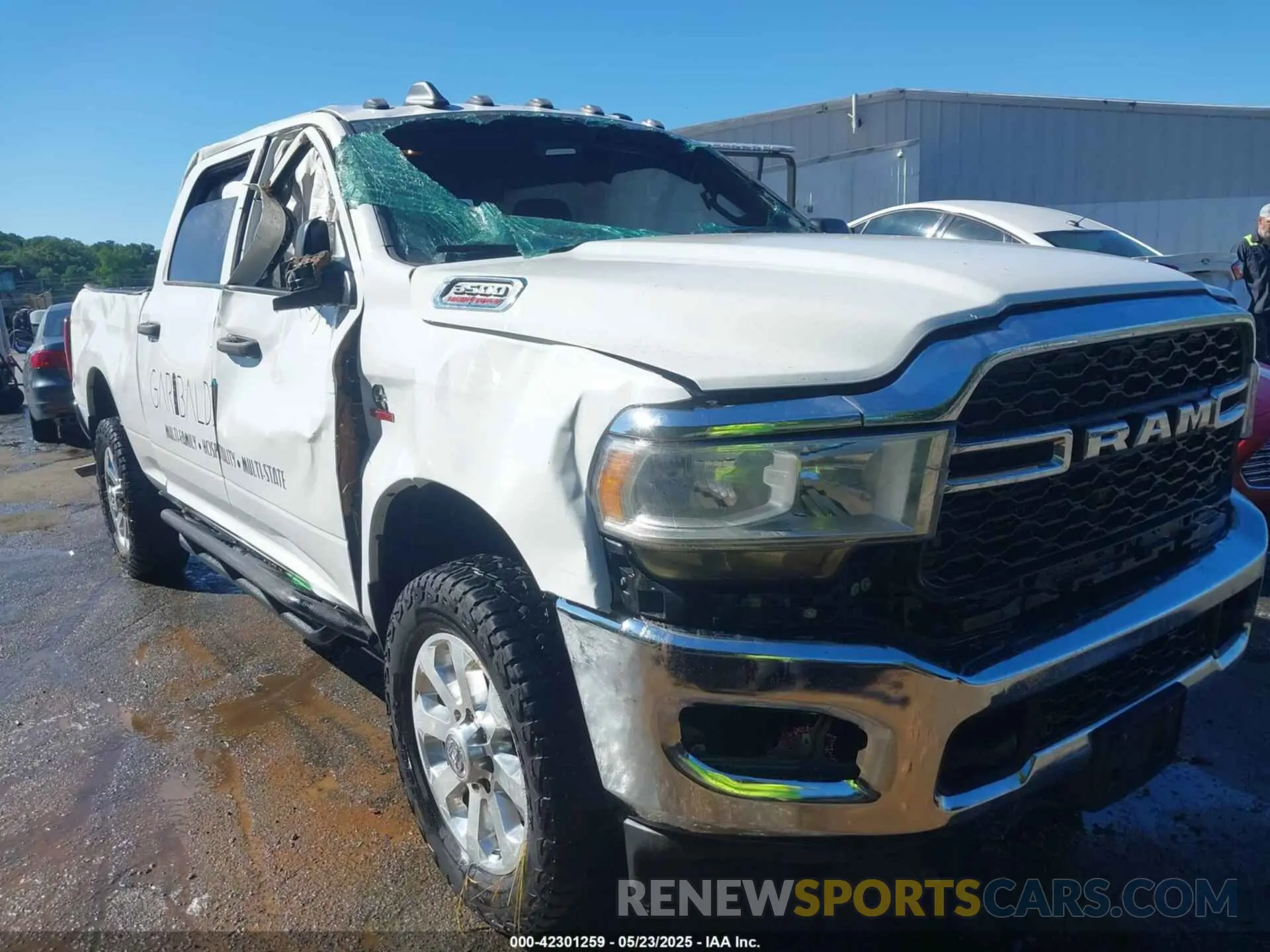 2 Photograph of a damaged car 3C63R3CL5MG550023 RAM 3500 2021