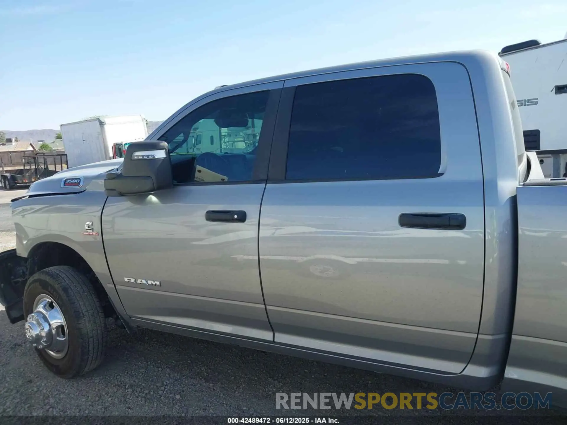 14 Photograph of a damaged car 3C63RRHL4PG542723 RAM 3500 2023