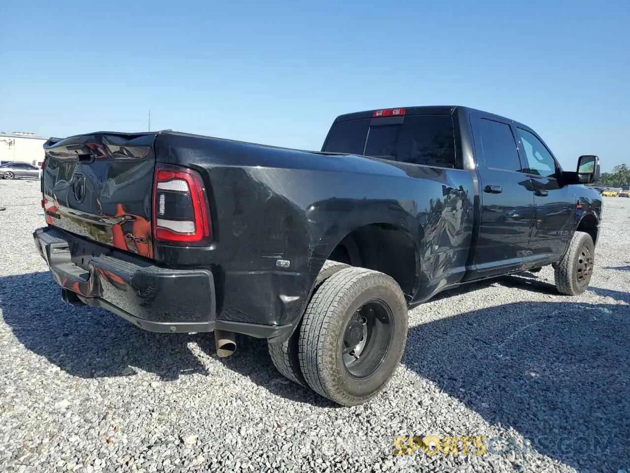 3 Photograph of a damaged car 3C63RRJL6PG508583 RAM 3500 2023