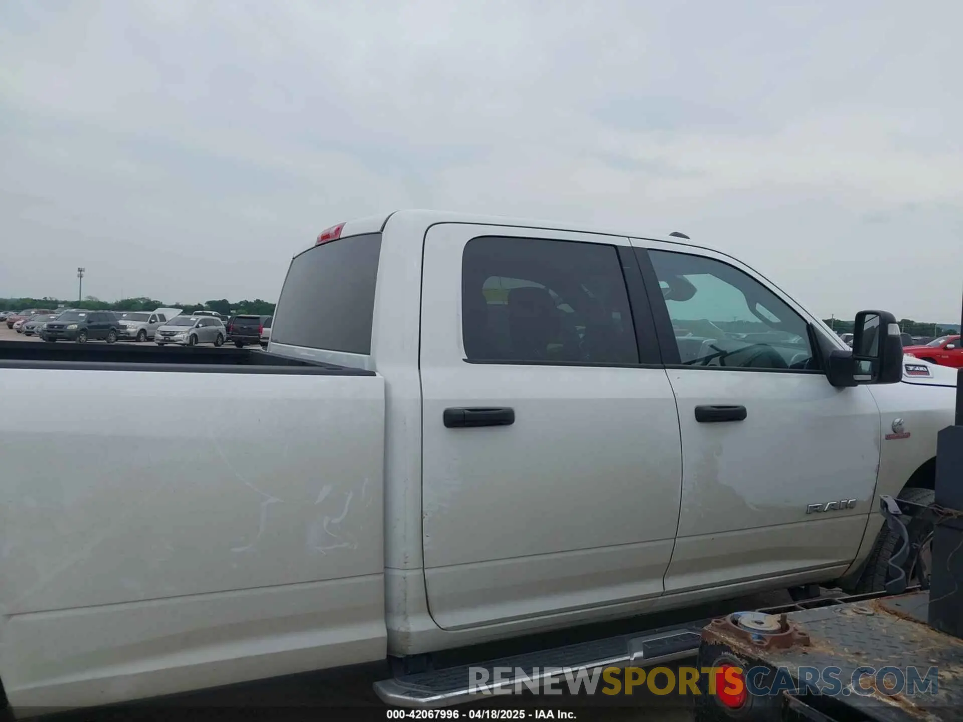 13 Photograph of a damaged car 3C63R3HL0RG358136 RAM 3500 2024