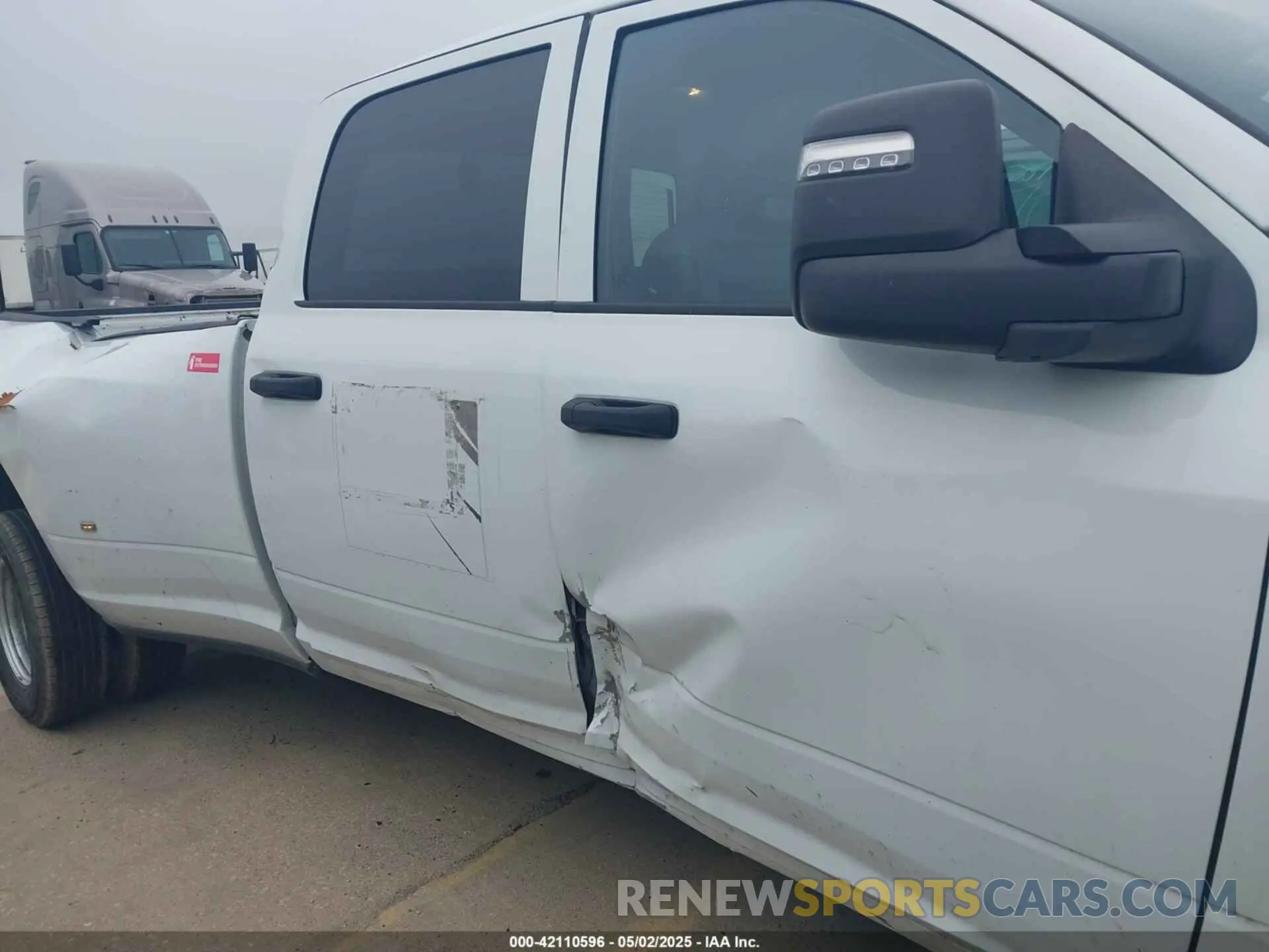 13 Photograph of a damaged car 3C63RRGL1RG256168 RAM 3500 2024