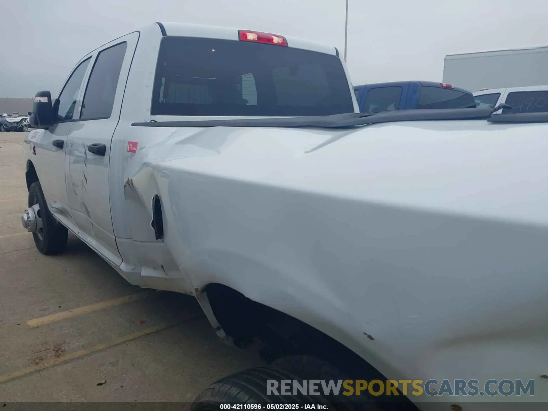 14 Photograph of a damaged car 3C63RRGL1RG256168 RAM 3500 2024