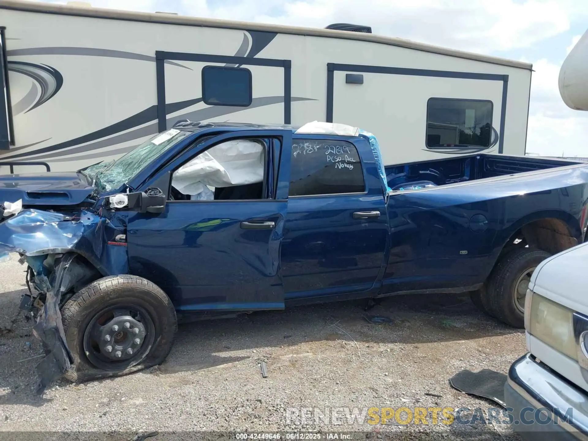 14 Photograph of a damaged car 3C63RRGL3RG339617 RAM 3500 2024