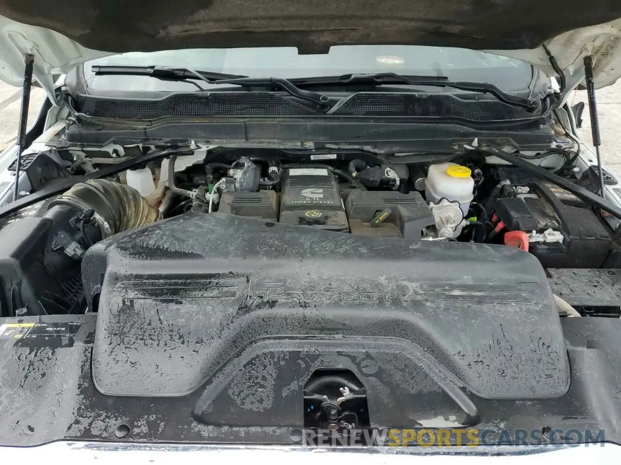 11 Photograph of a damaged car 3C63RRHL1RG271736 RAM 3500 2024