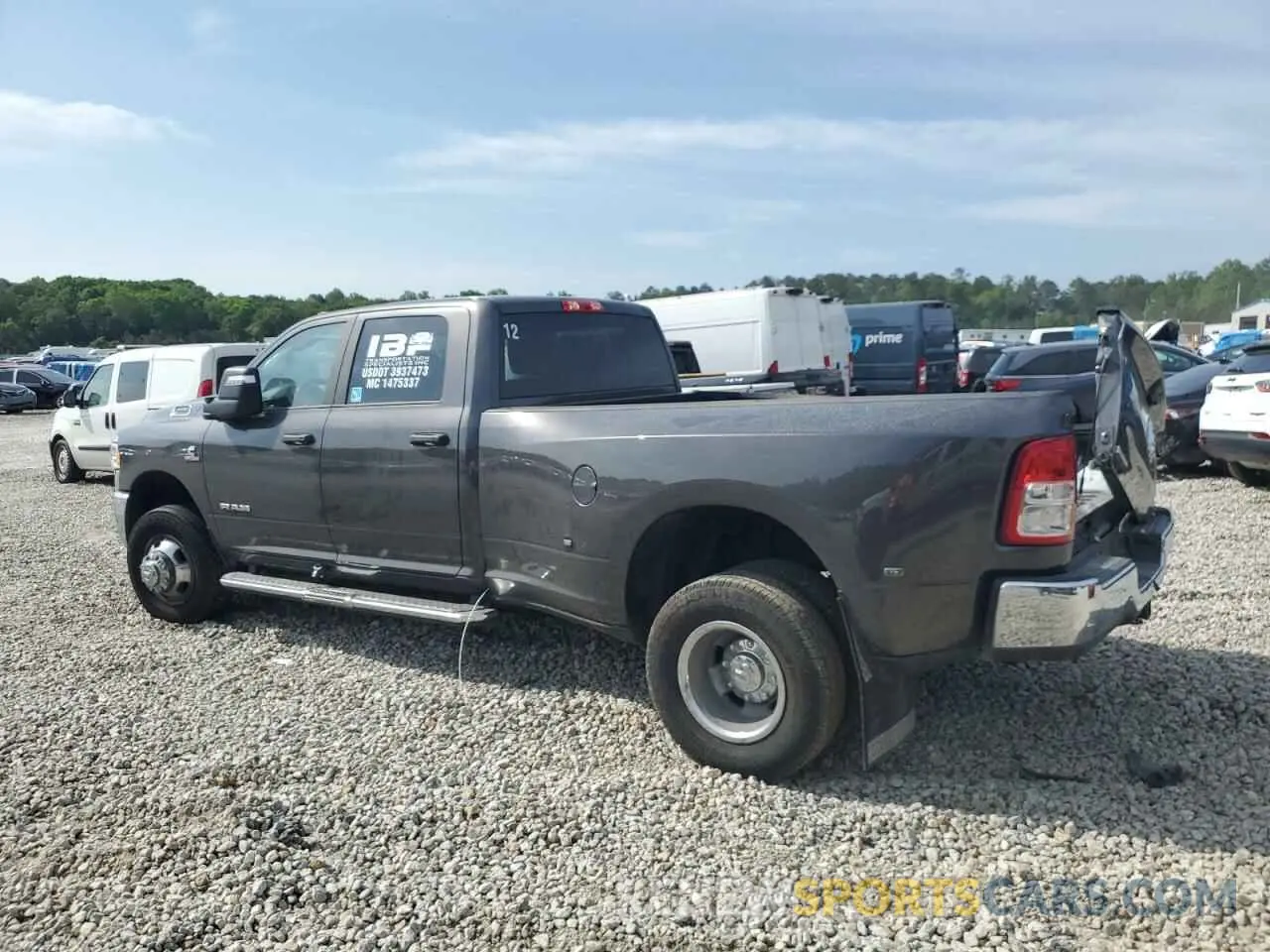 2 Photograph of a damaged car 3C63RRHL7RG360064 RAM 3500 2024
