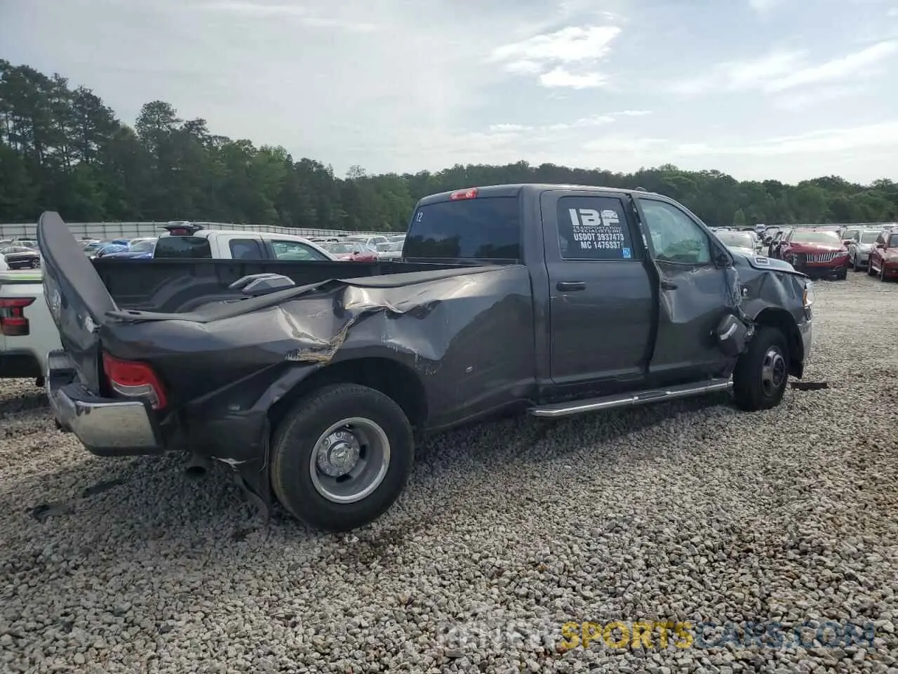3 Photograph of a damaged car 3C63RRHL7RG360064 RAM 3500 2024