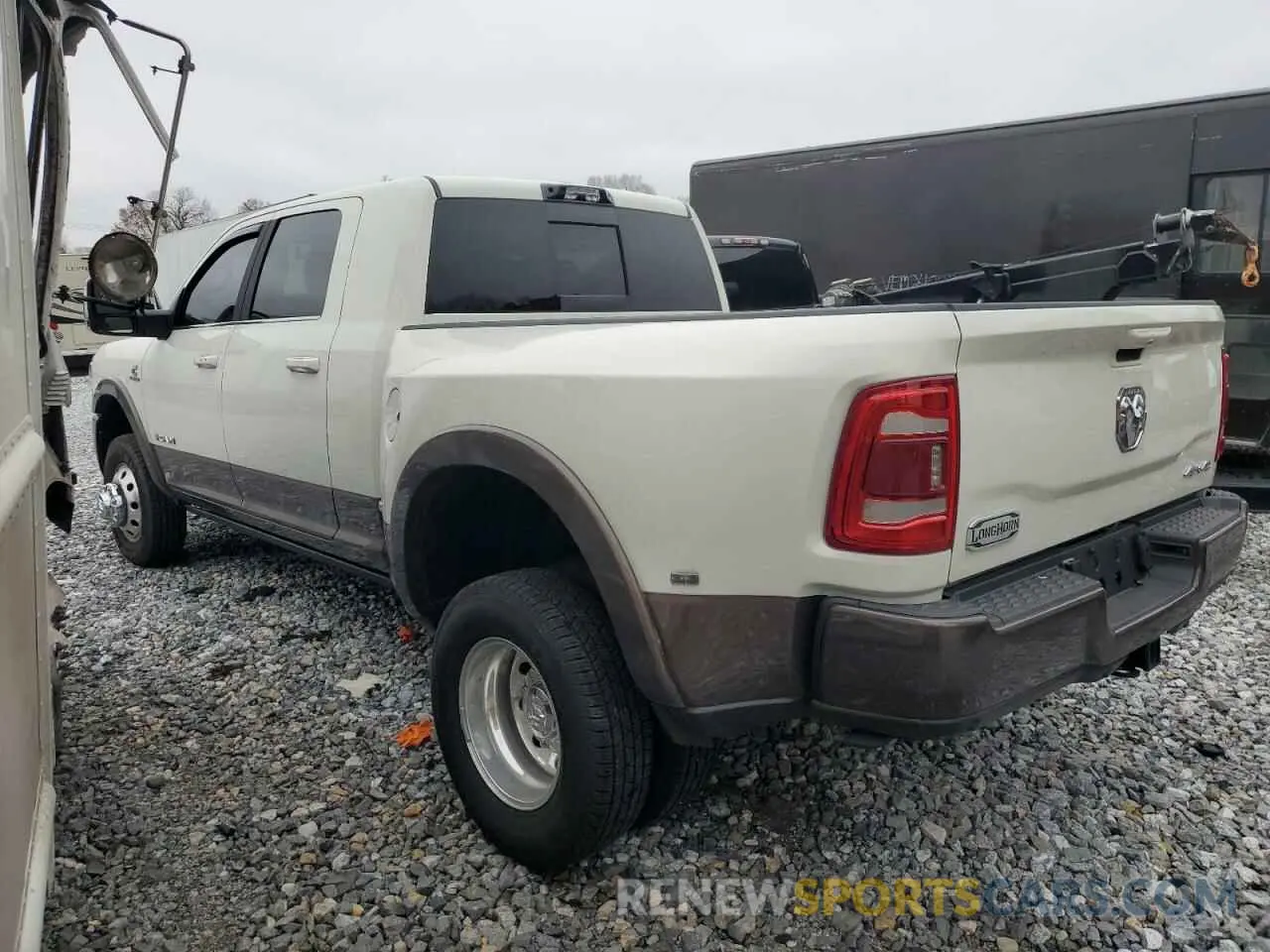 2 Photograph of a damaged car 3C63RRNL6RG112988 RAM 3500 2024