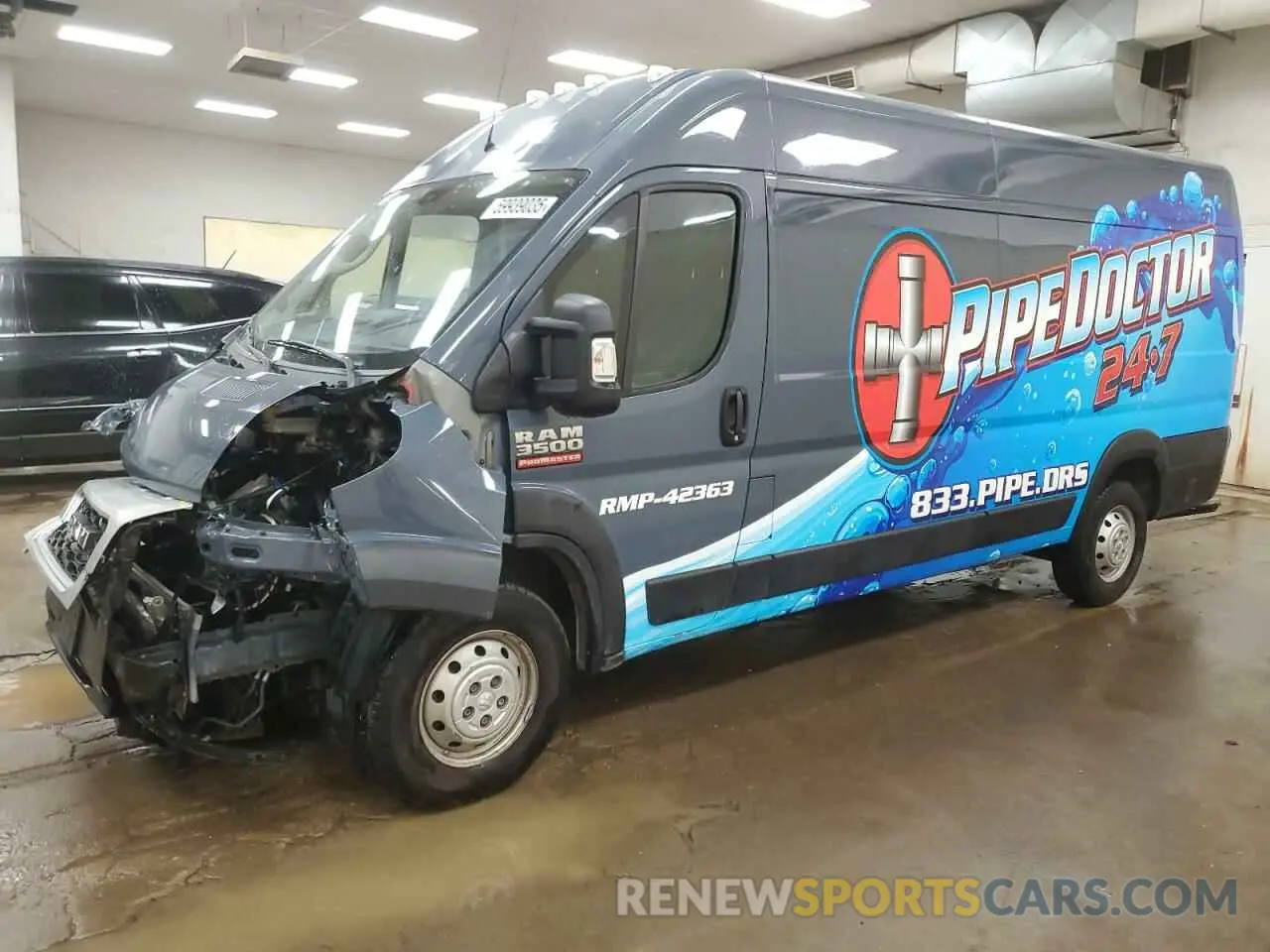 1 Photograph of a damaged car 3C6URVJG3KE564100 RAM All Models 2019