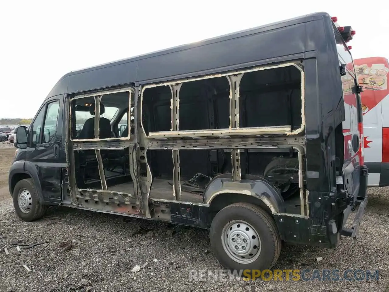 2 Photograph of a damaged car 3C6LRVDG7PE543295 RAM All Models 2023
