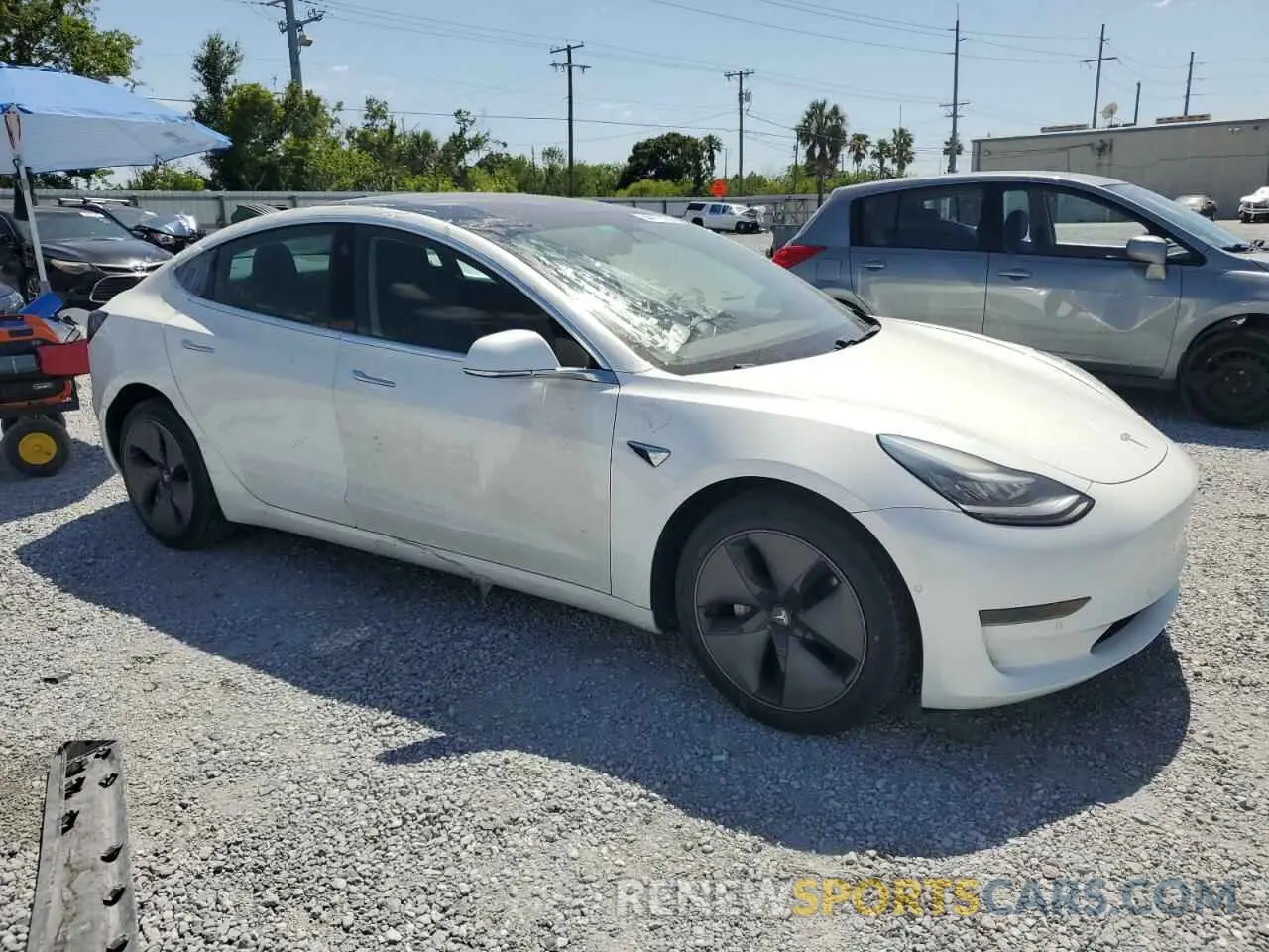 4 Photograph of a damaged car 5YJ3E1EA8LF659083 TESLA MODEL 3 2020