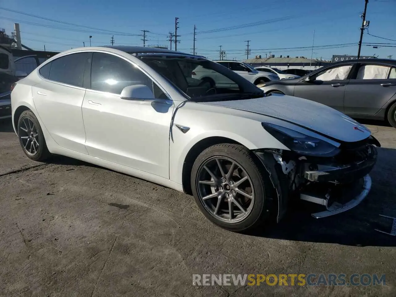 4 Photograph of a damaged car 5YJ3E1EB0LF665887 TESLA MODEL 3 2020
