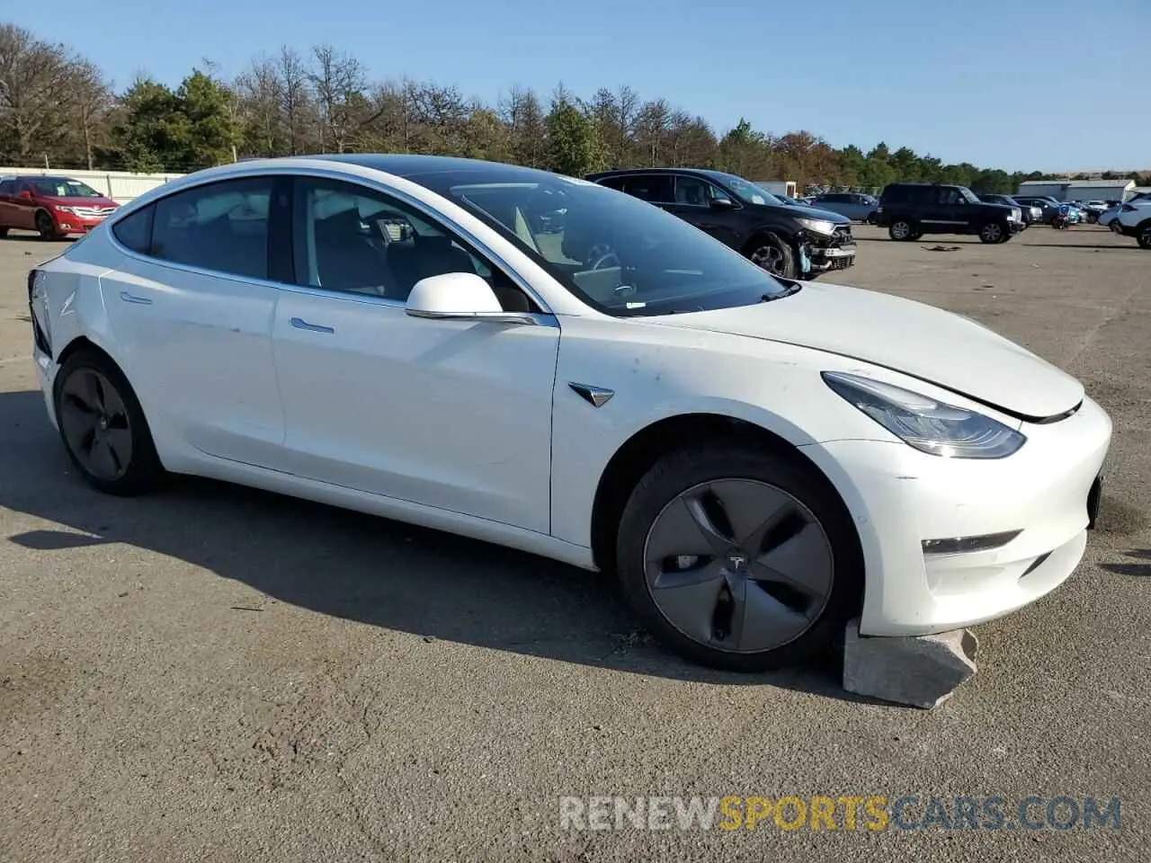 4 Photograph of a damaged car 5YJ3E1EB2LF795217 TESLA MODEL 3 2020