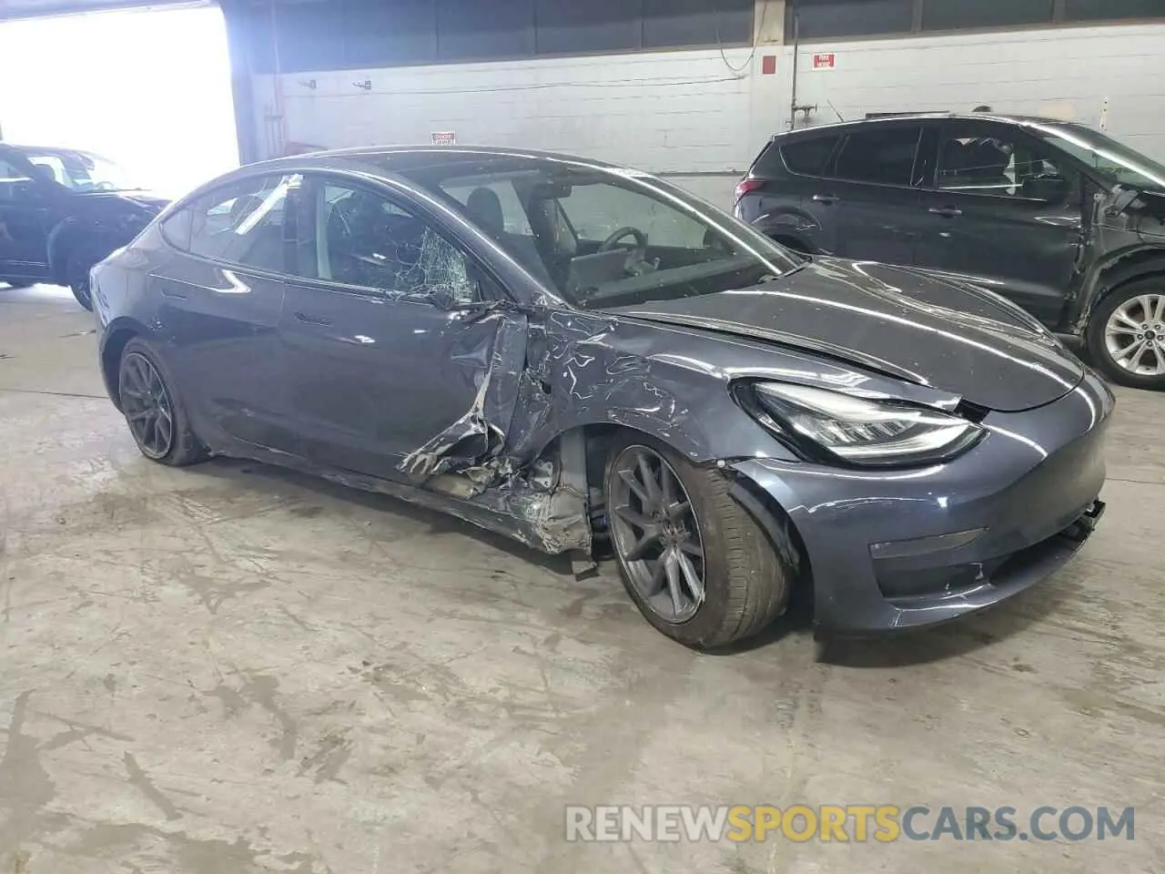 4 Photograph of a damaged car 5YJ3E1EB3MF848122 TESLA MODEL 3 2021