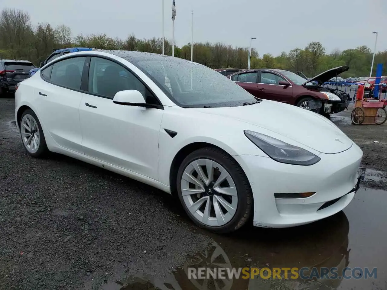 4 Photograph of a damaged car 5YJ3E1EB7MF943718 TESLA MODEL 3 2021