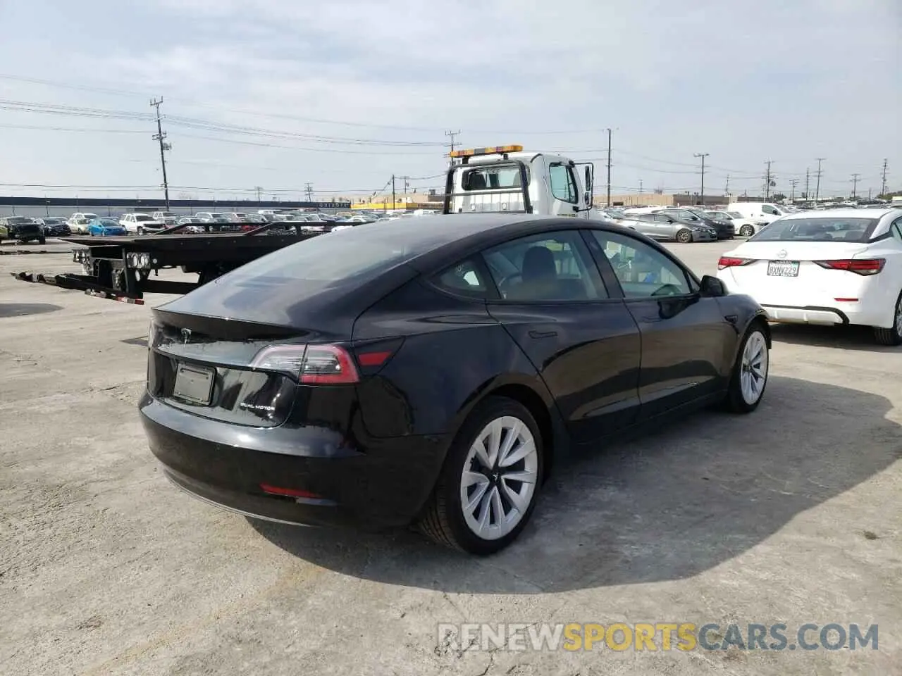 4 Photograph of a damaged car 5YJ3E1EB8MF989977 TESLA MODEL 3 2021