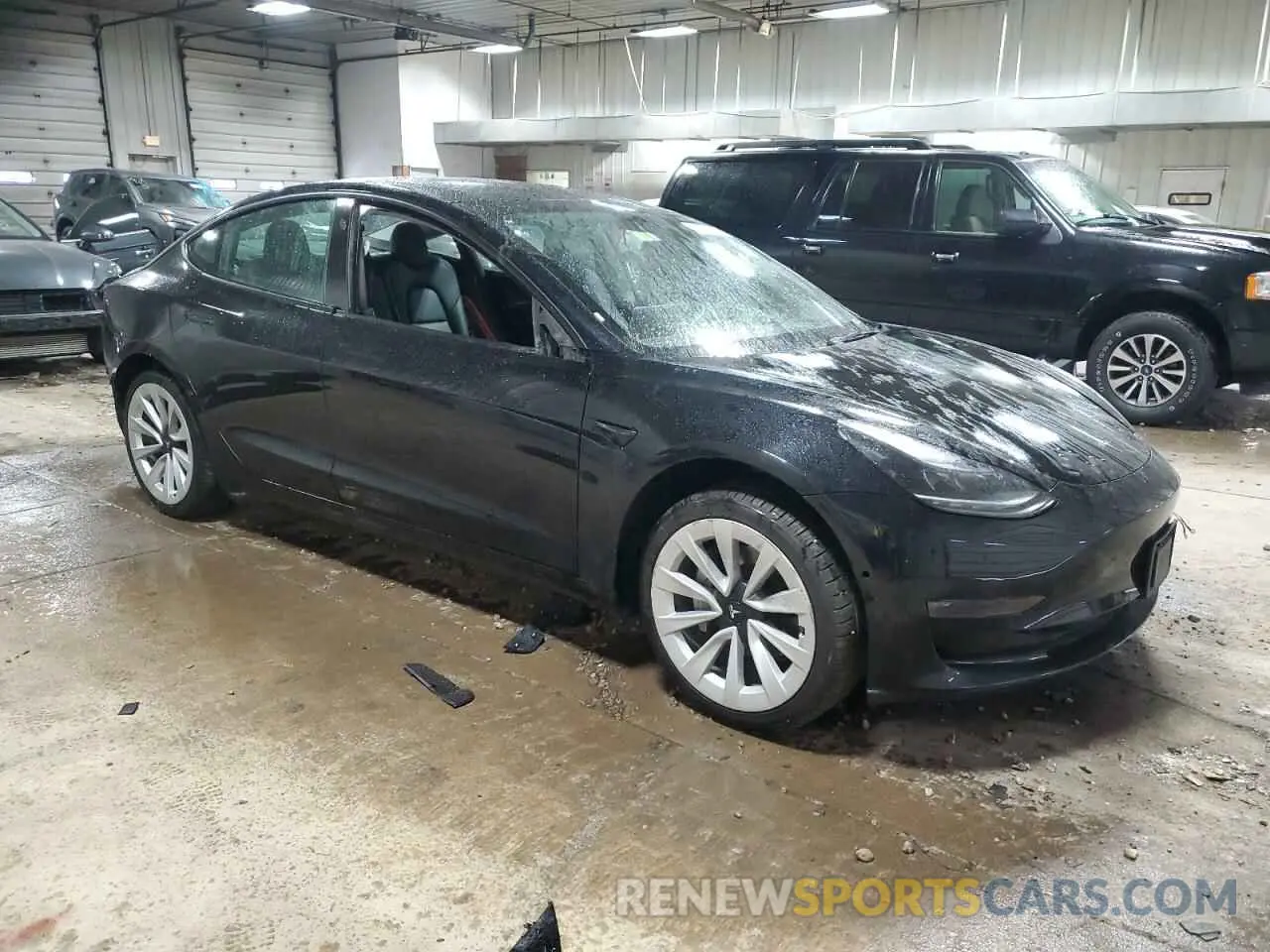 4 Photograph of a damaged car 5YJ3E1EA1NF189871 TESLA MODEL 3 2022