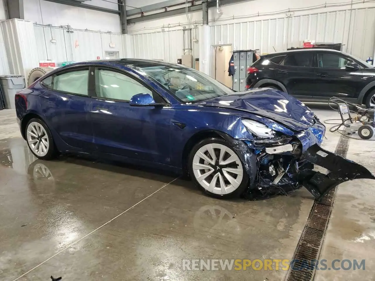 4 Photograph of a damaged car 5YJ3E1EA1NF371070 TESLA MODEL 3 2022