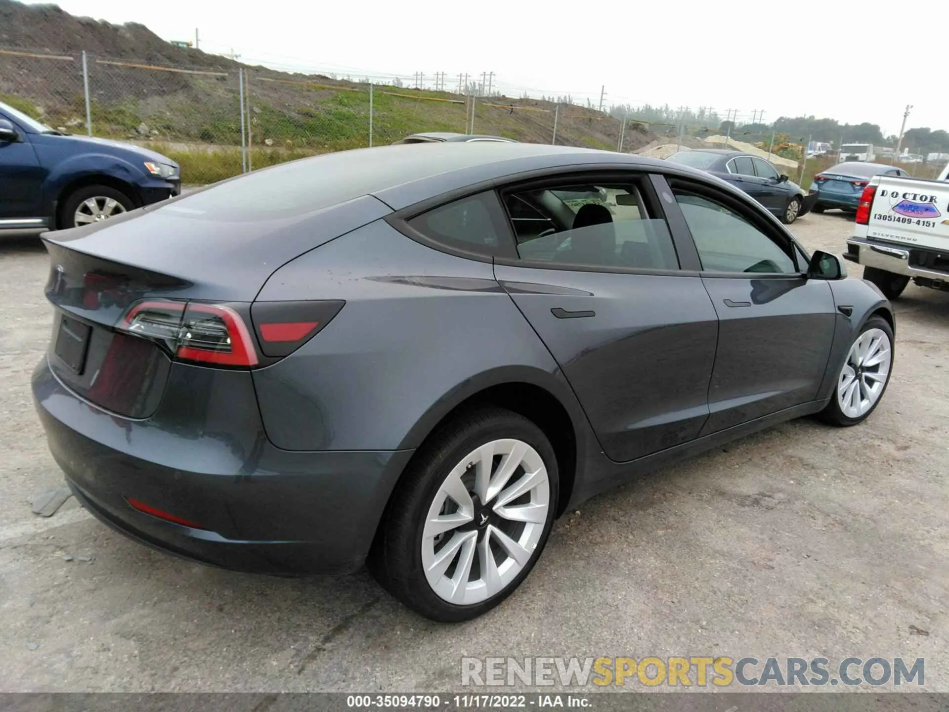 4 Photograph of a damaged car 5YJ3E1EA9NF311148 TESLA MODEL 3 2022