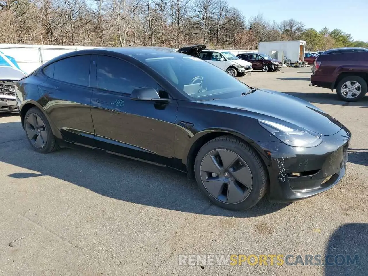 4 Photograph of a damaged car 5YJ3E1EB2NF230906 TESLA MODEL 3 2022