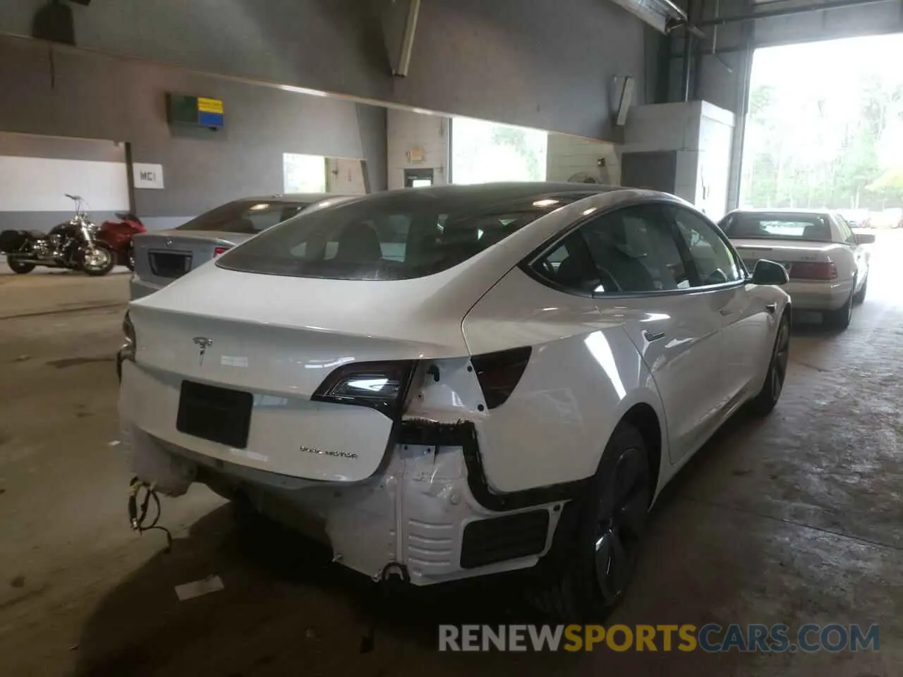 4 Photograph of a damaged car 5YJ3E1EB8NF107403 TESLA MODEL 3 2022