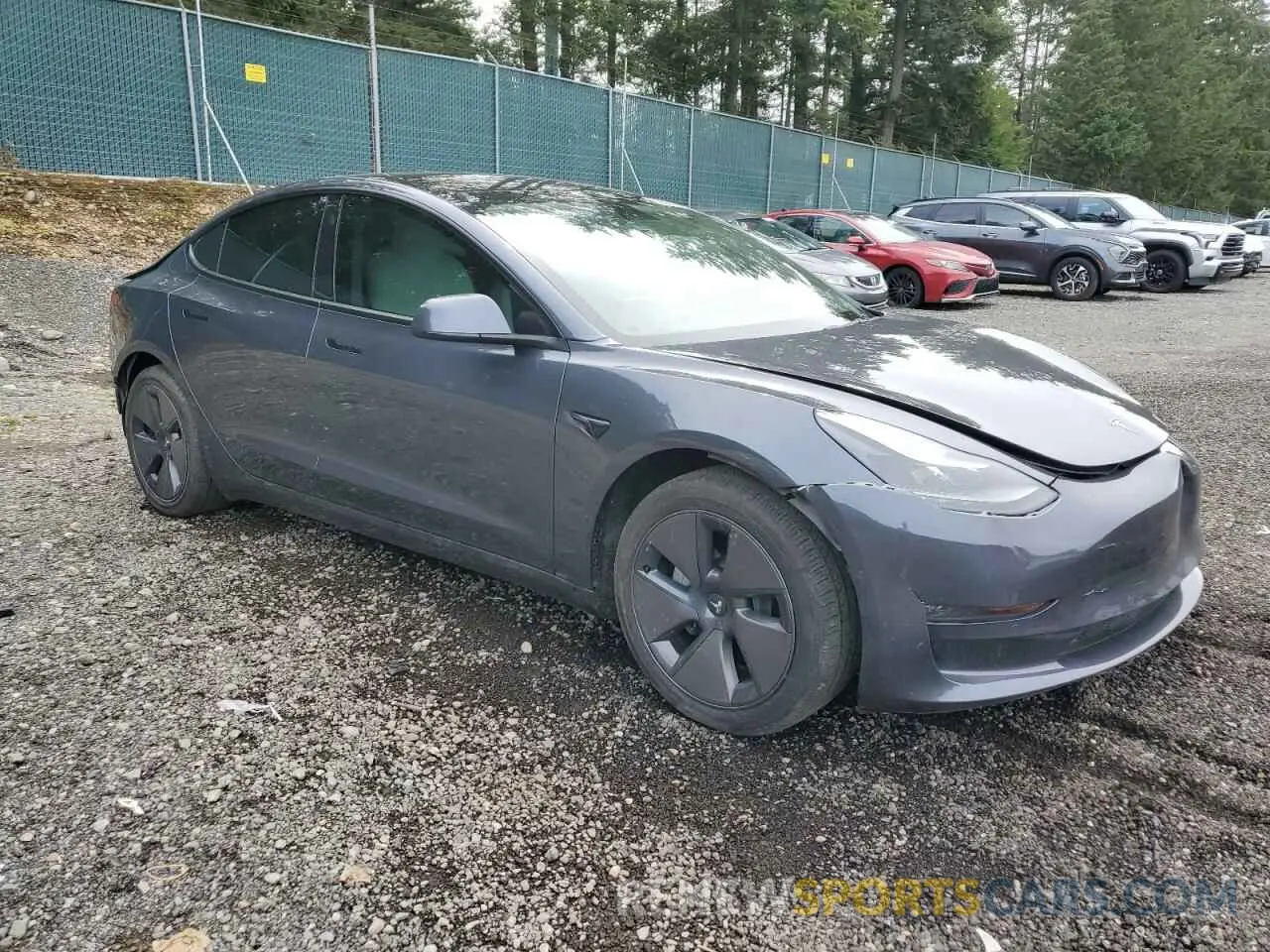 4 Photograph of a damaged car 5YJ3E1EB8NF272738 TESLA MODEL 3 2022