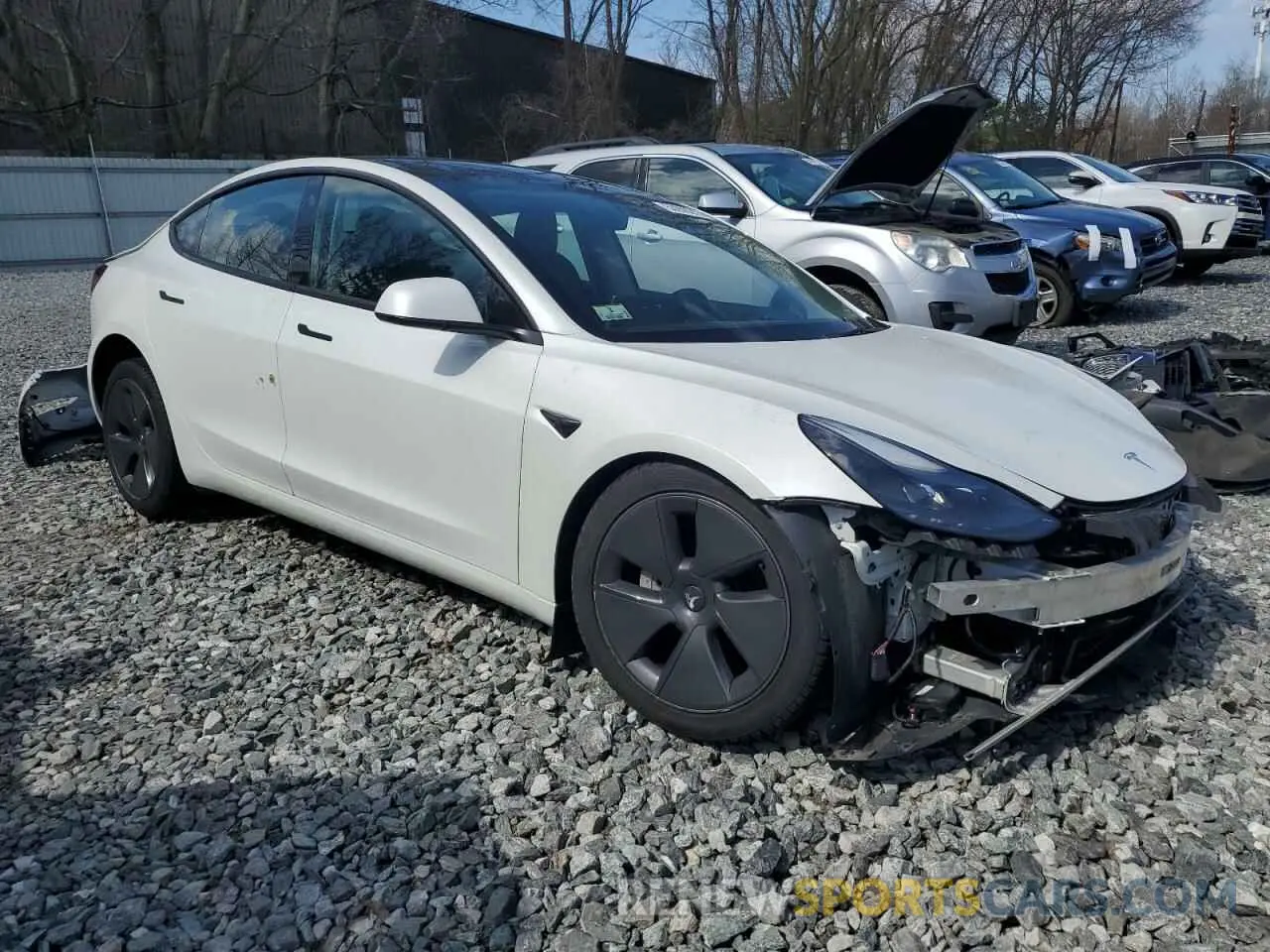4 Фотография поврежденного автомобиля 5YJ3E1EB9NF159977 TESLA MODEL 3 2022