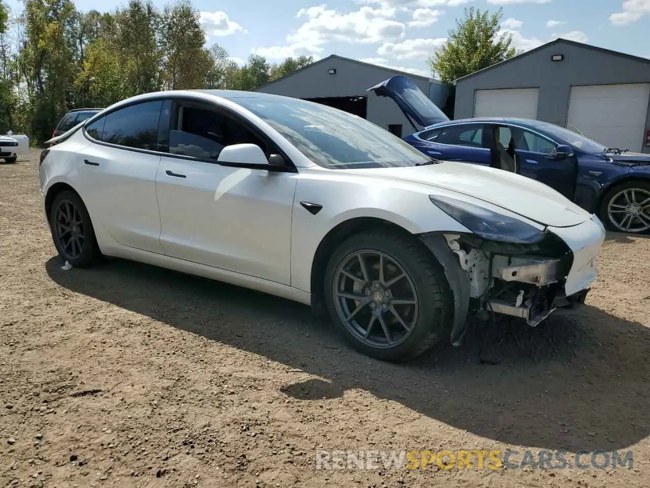 4 Photograph of a damaged car 5YJ3E1EBXNF193443 TESLA MODEL 3 2022