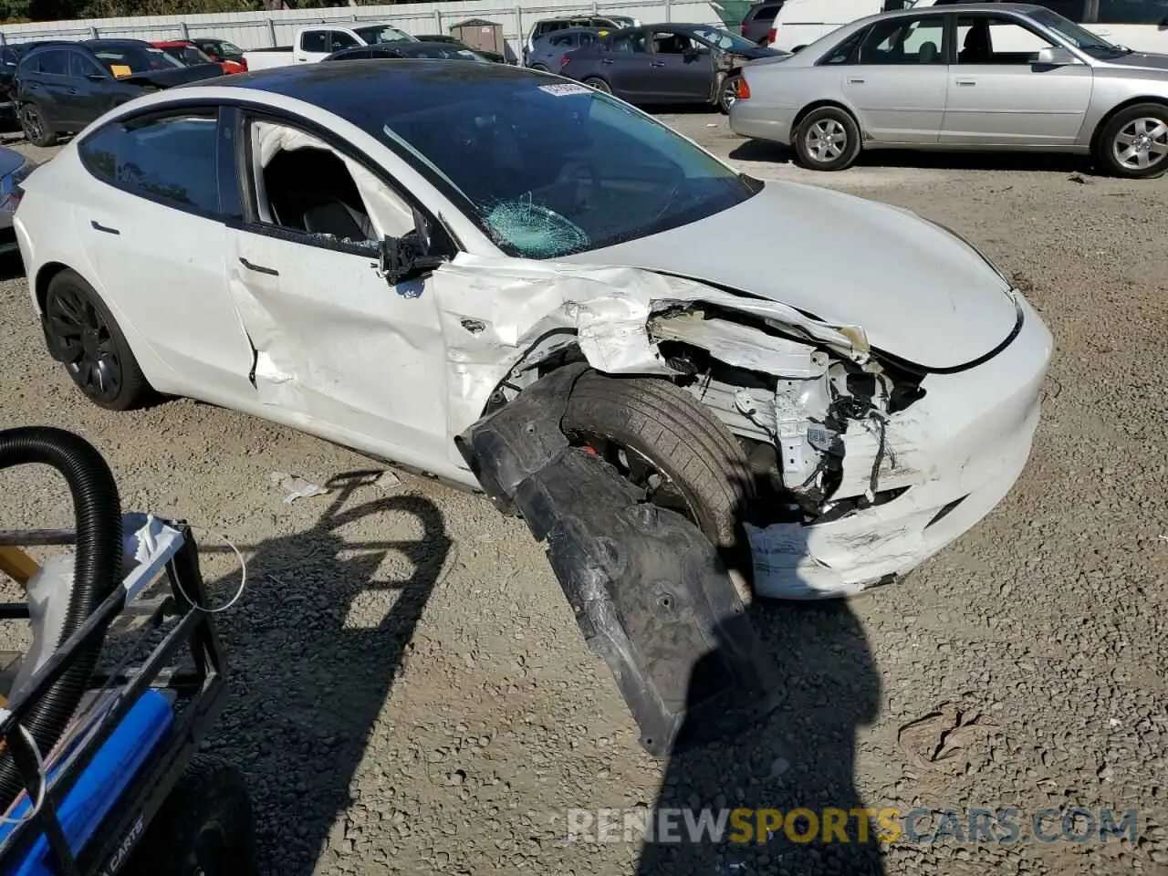 4 Photograph of a damaged car 5YJ3E1EC2NF195969 TESLA MODEL 3 2022
