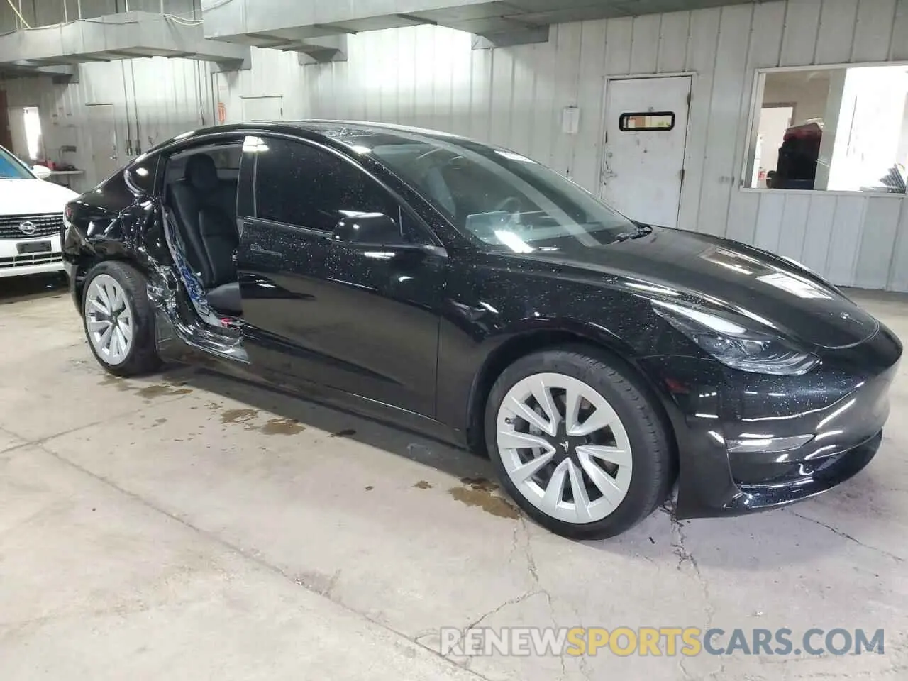 4 Photograph of a damaged car 5YJ3E1EA0PF490697 TESLA MODEL 3 2023