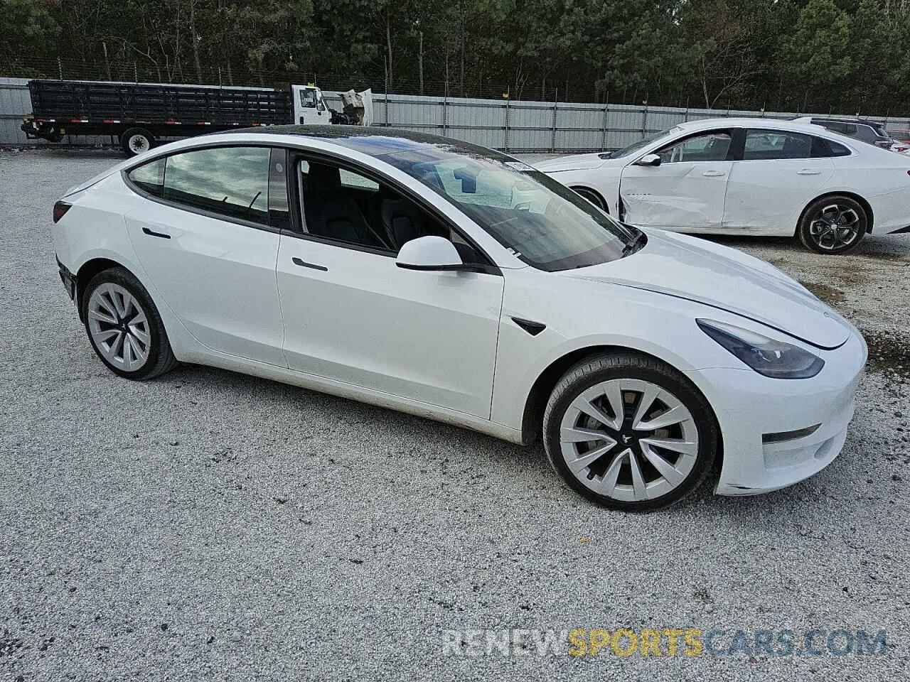 4 Photograph of a damaged car 5YJ3E1EA1PF437930 TESLA MODEL 3 2023