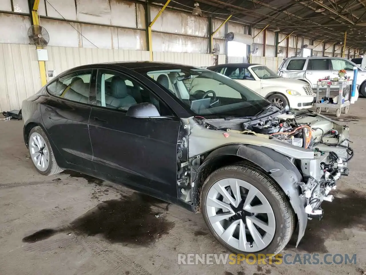 4 Photograph of a damaged car 5YJ3E1EA7PF703581 TESLA MODEL 3 2023
