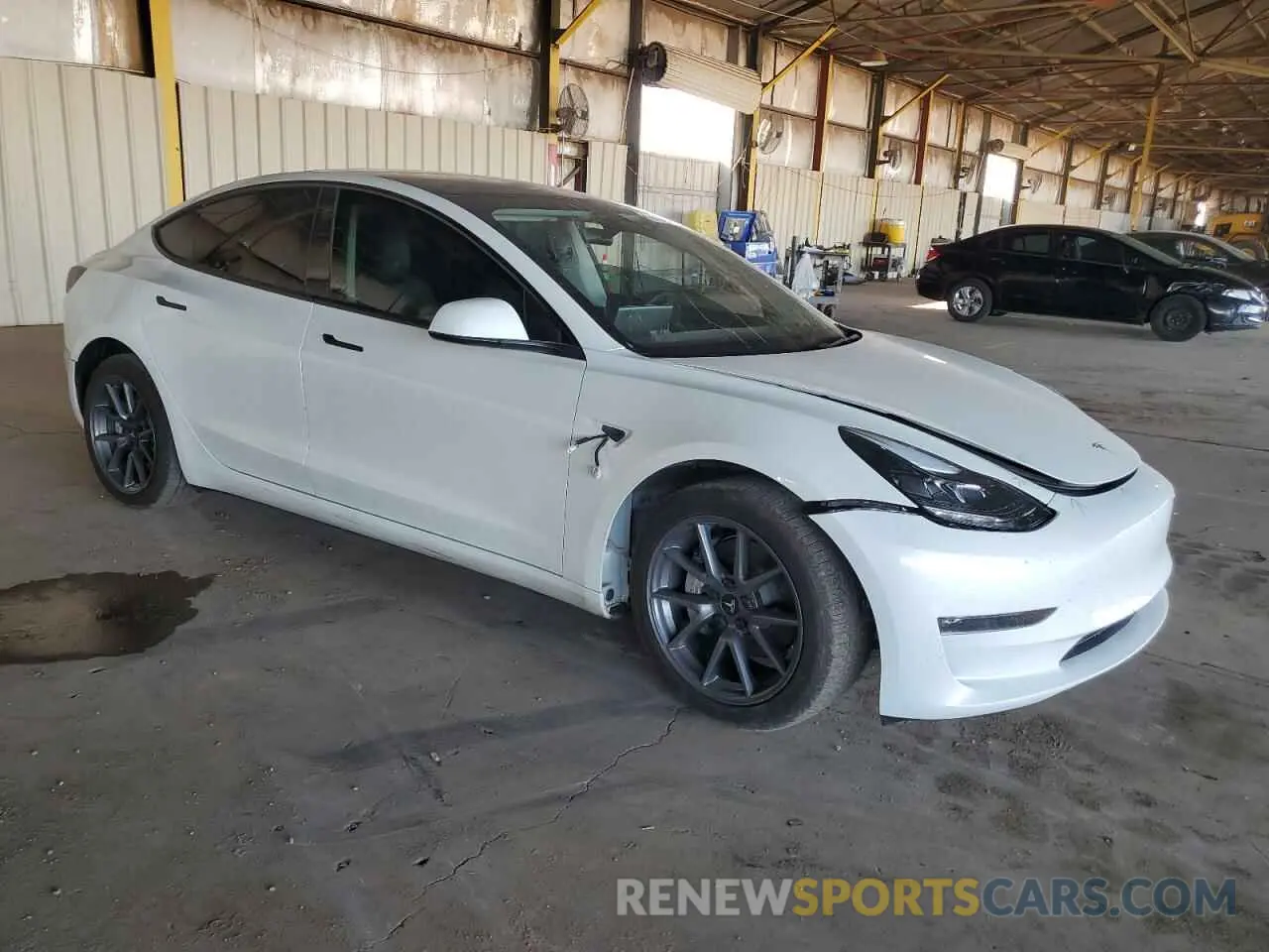 4 Photograph of a damaged car 5YJ3E1EB1PF710423 TESLA MODEL 3 2023