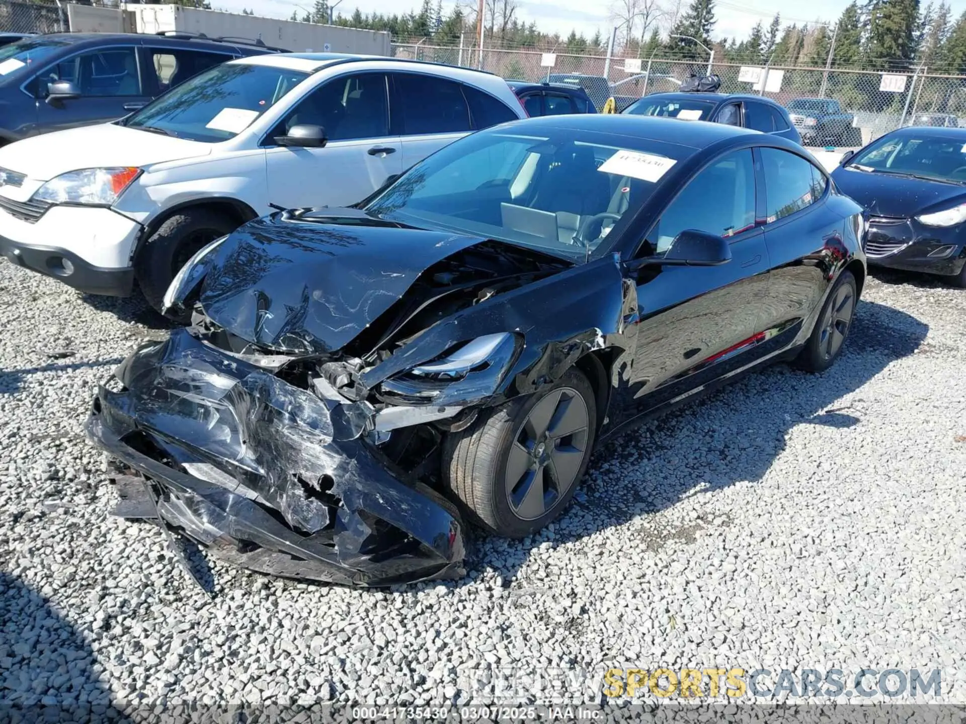 2 Photograph of a damaged car 5YJ3E1EB7PF657274 TESLA MODEL 3 2023
