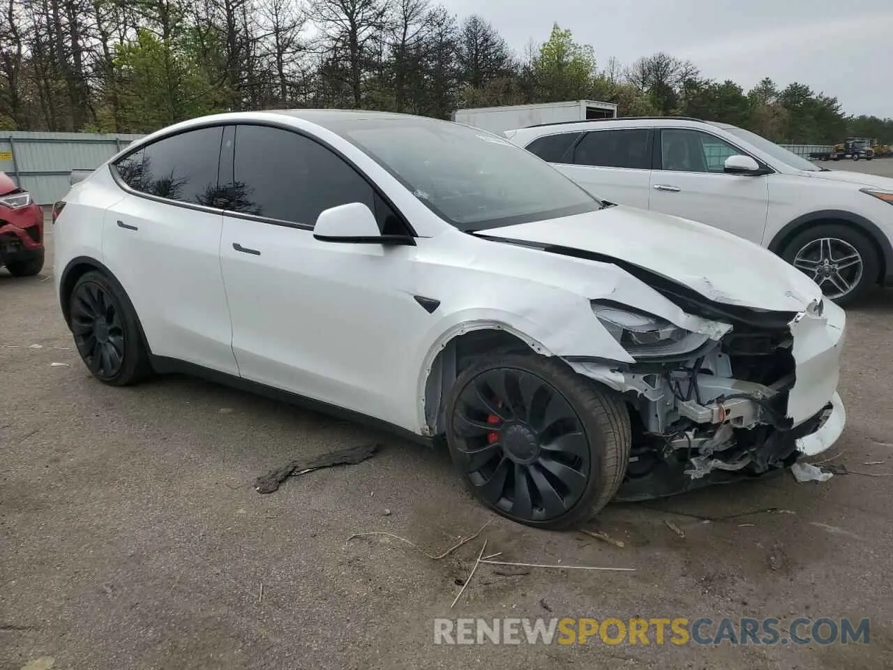 4 Photograph of a damaged car 7SAYGDEF3NF523706 TESLA MODEL Y 2022