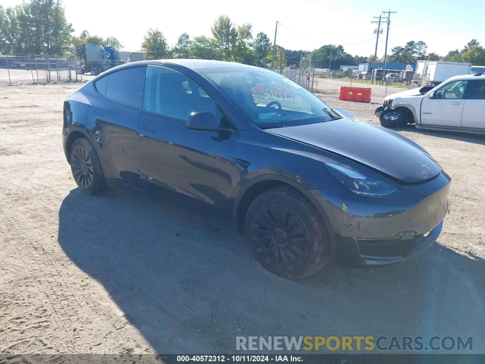 1 Photograph of a damaged car 7SAYGDED3RF092501 TESLA MODEL Y 2024