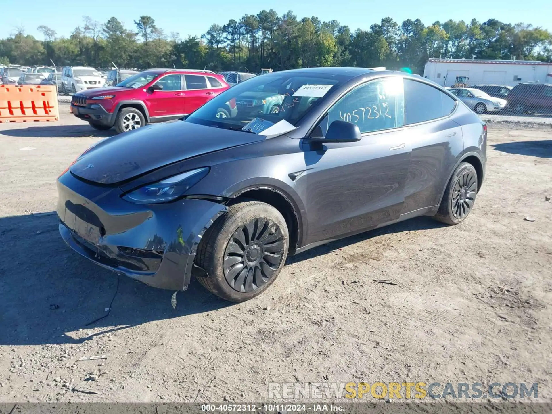 2 Photograph of a damaged car 7SAYGDED3RF092501 TESLA MODEL Y 2024
