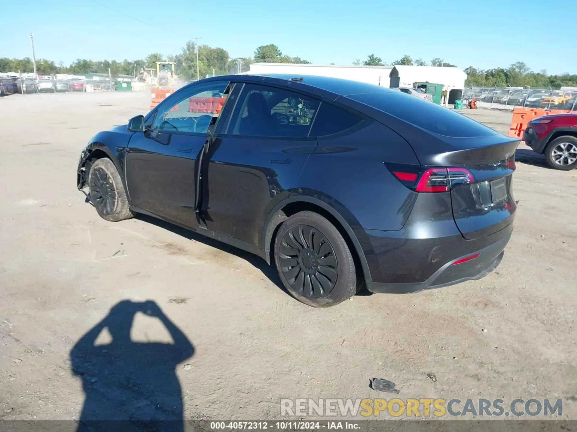 3 Photograph of a damaged car 7SAYGDED3RF092501 TESLA MODEL Y 2024