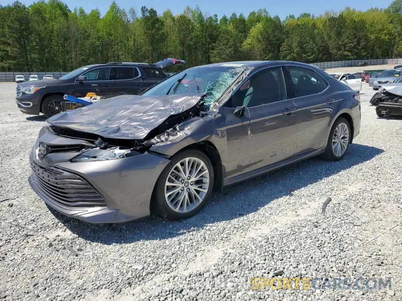 1 Photograph of a damaged car 4T1B11HK4KU725979 TOYOTA CAMRY 2019