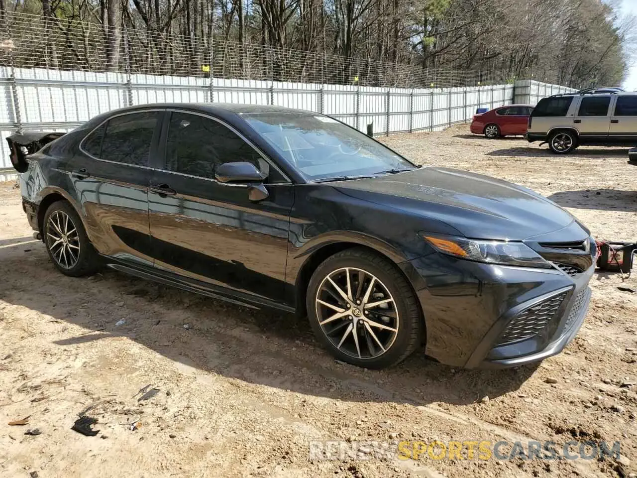 4 Photograph of a damaged car 4T1T11AK1PU767063 TOYOTA CAMRY 2023